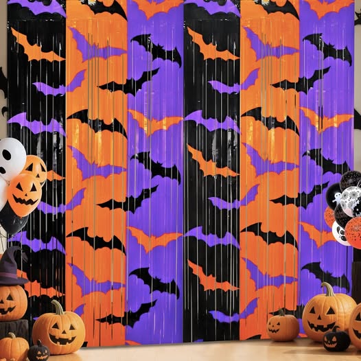 These Halloween Foil Fringe Curtains (2 pack, 3.3 x 6.6 ft) are 50% off