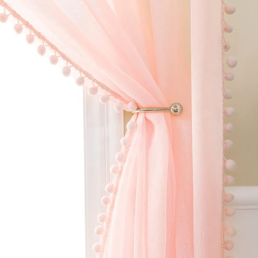 These Sheer Curtains with Pom Poms on them have a 50% off
